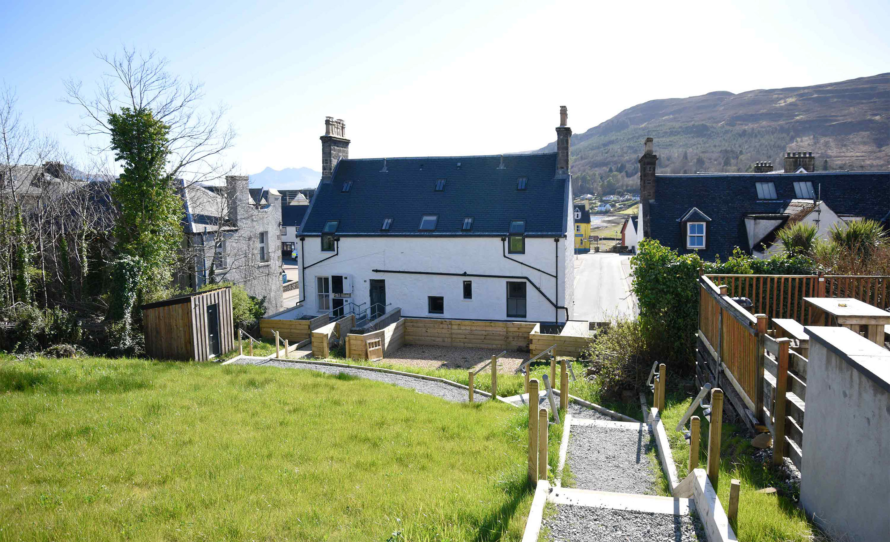 Relax in Taransay House Luxury Accommodation in Portree public seating area with woodburning stove