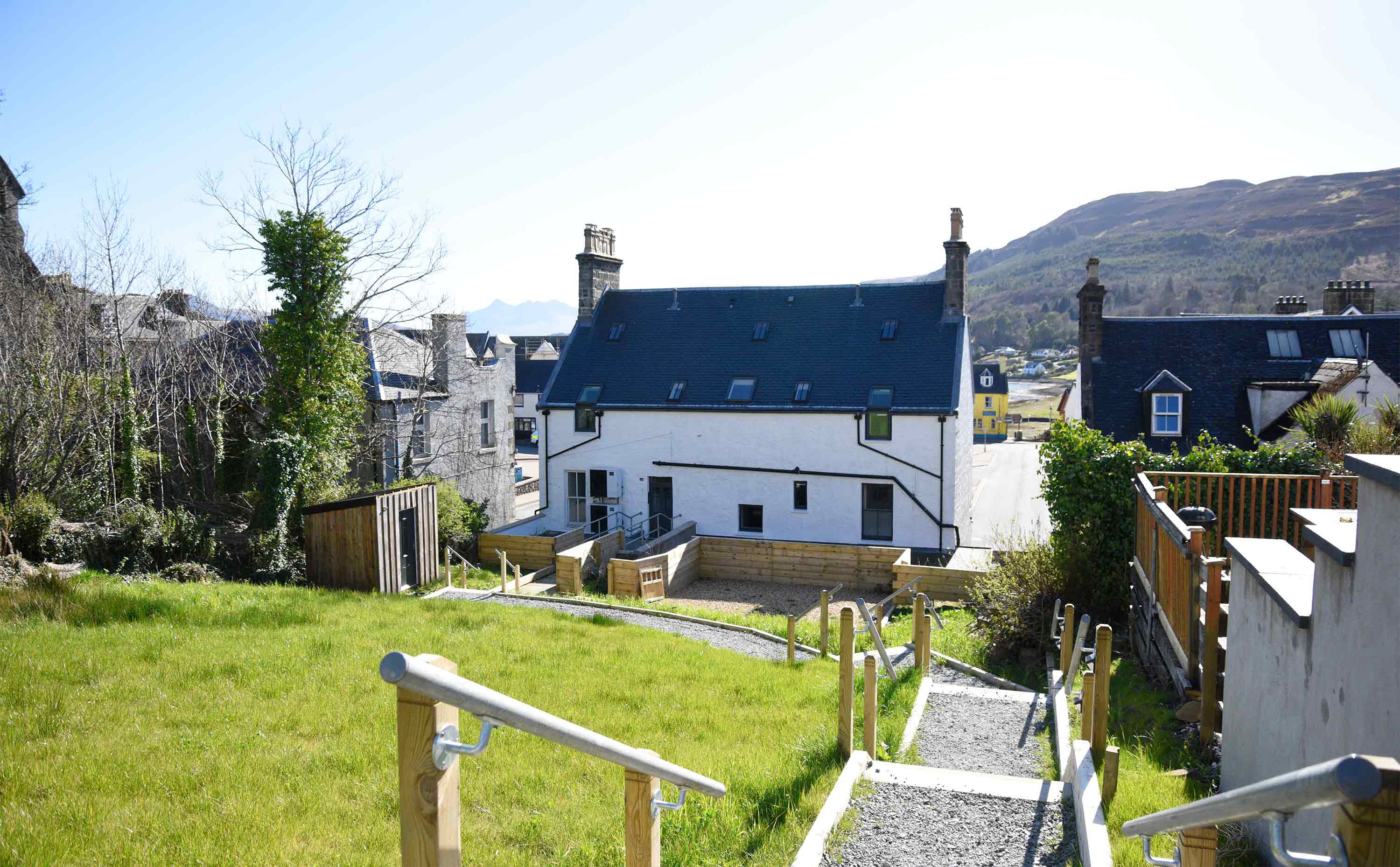 Relax in Taransay House Luxury Accommodation in Portree public seating area with woodburning stove