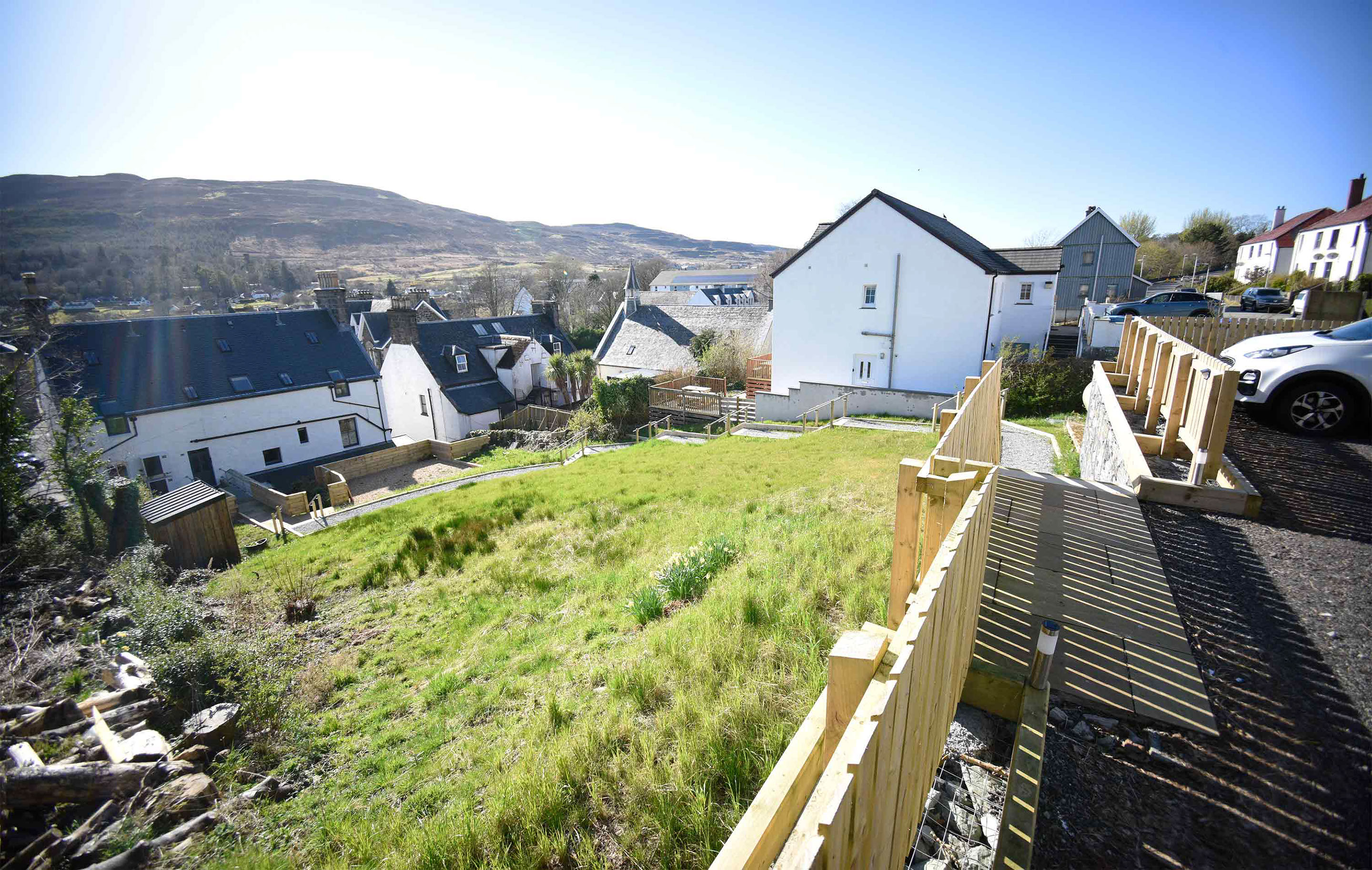 Relax in Taransay House Luxury Accommodation in Portree public seating area with woodburning stove