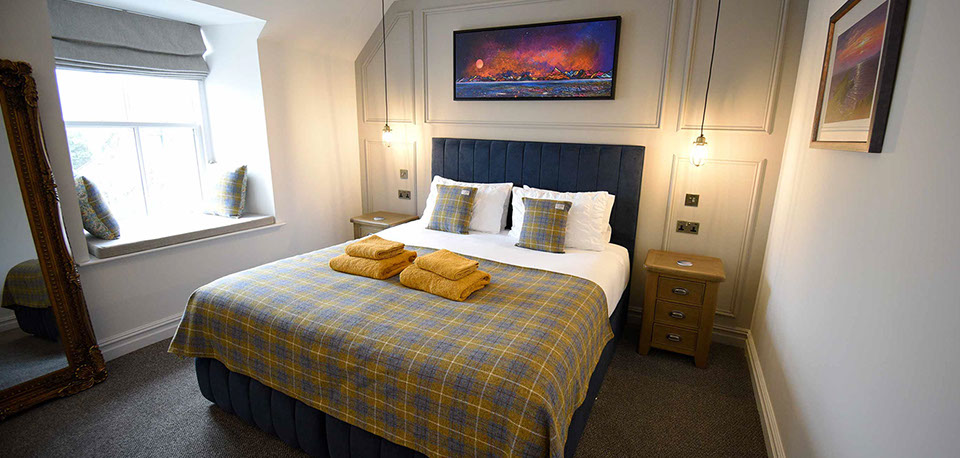 Somerled House Suites contains a king size double bed with all bedding and linen provided at our Portree accommodation