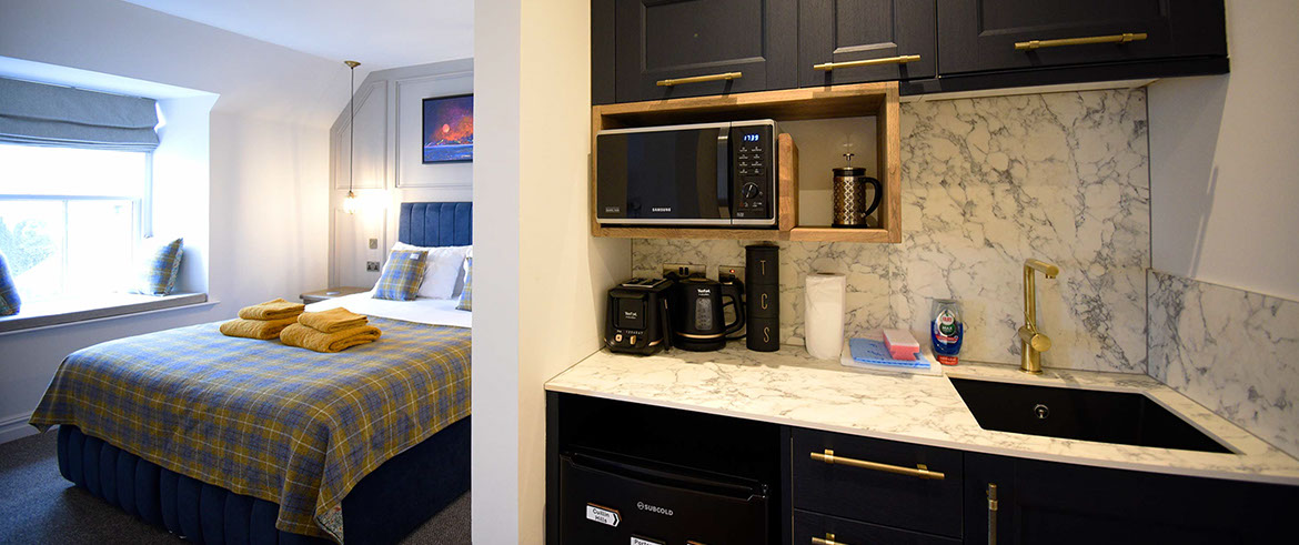 Somerled House Suites self catering accommodation apartments contain a King size bed and kitchenette Portree accommodation