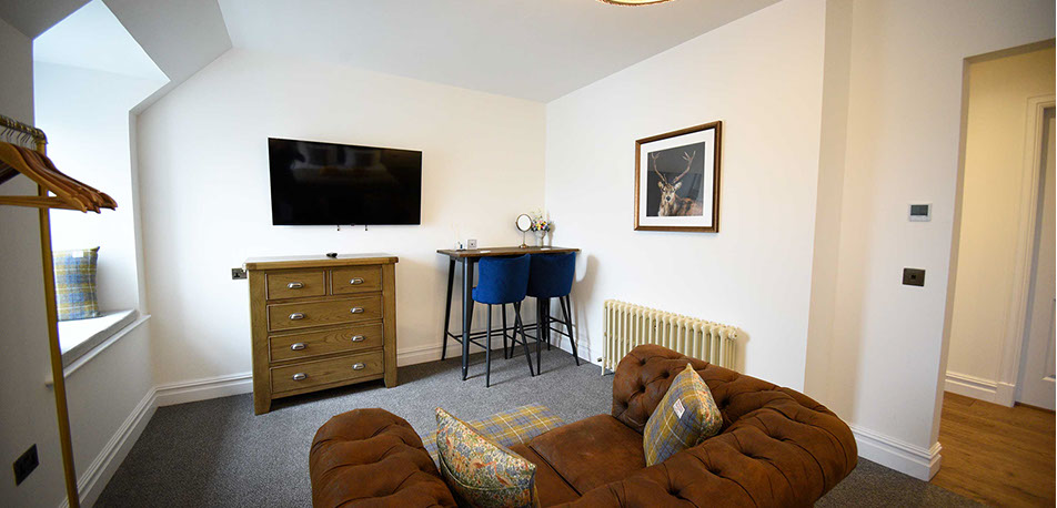 Our Portree accommodation Somerled House Suites contains a cosy living room with widescreen TV